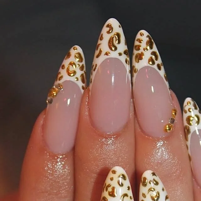 Elegant white gold nails with intricate designs and festive themes