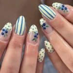 Wild blueberry nails art by Reina showcasing a vibrant blueberry theme