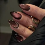 Chic dark spring nails showcasing trendy designs for your next manicure.