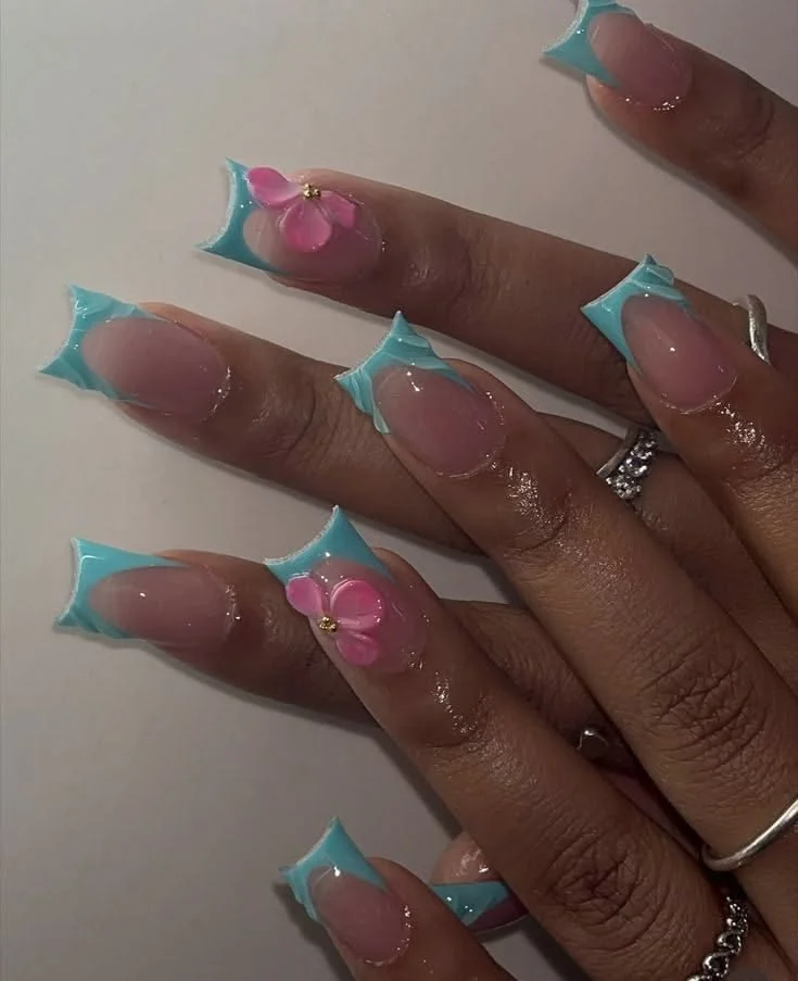 Colorful nail designs featuring French tips, bows, and blue-pink aesthetics.