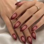 Black Cherry Aura Nails with glossy nude to wine ombre on almond-shaped nails