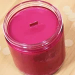 DIY scented soy wax candles with wooden wicks, wine, and sprinkles.