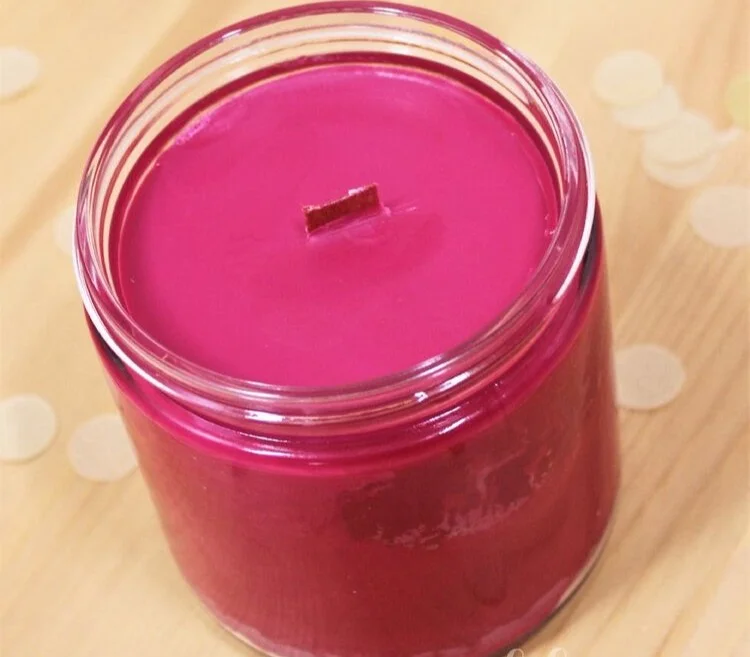DIY scented soy wax candles with wooden wicks, wine, and sprinkles.