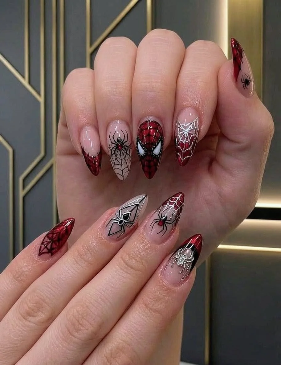 Stylish spider nails design featuring intricate patterns and colors.