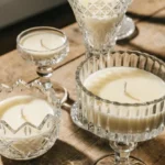 Gorgeous DIY vintage teacup candles displayed on a wooden table.