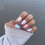 Hand painted nautical press on nails with blue and pink fish and starfish design