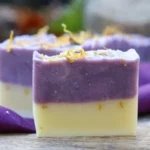 Homemade lemongrass lavender soap bar with fresh herbs and flowers