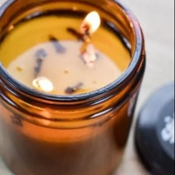 Candles with strong scent throw enhancing home ambiance.
