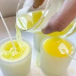 Homemade mosquito-repelling citronella candles in jars