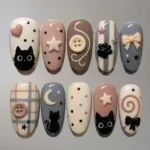 Kawaii cat press on nails with 3D button bows, plaid, and polka dot designs