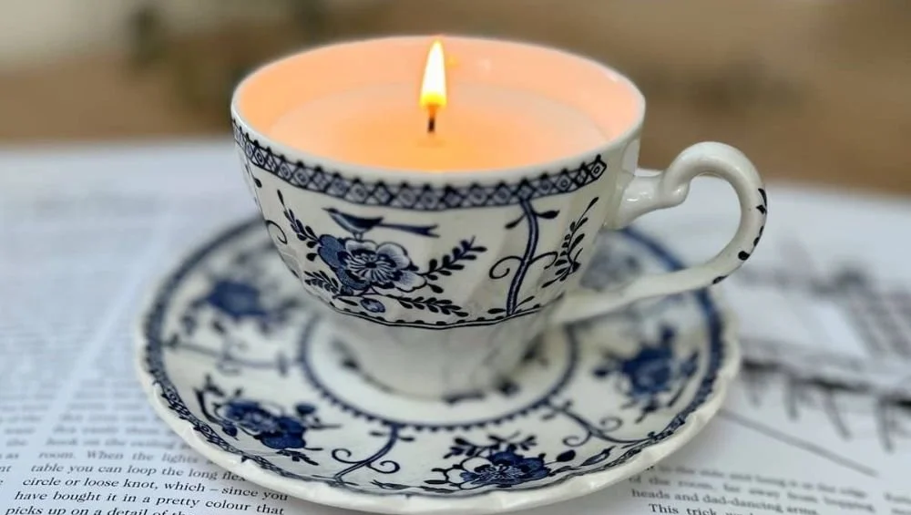 DIY soy candles made in unique containers from charity shops.