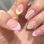 Close-up of stylish and colorful nails showcasing the latest nail trends.