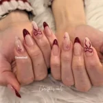 Red and white almond nail design for Christmas inspiration on simple stylish nails