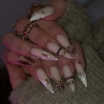 DIY silhouette nail art featuring strass and pearls for a stunning look