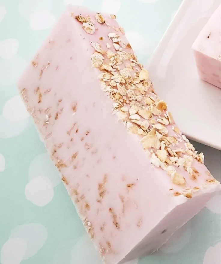 A bar of homemade oatmeal soap with cherry almond fragrance