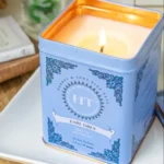 Hand poured candle in a decorative tea tin craft.