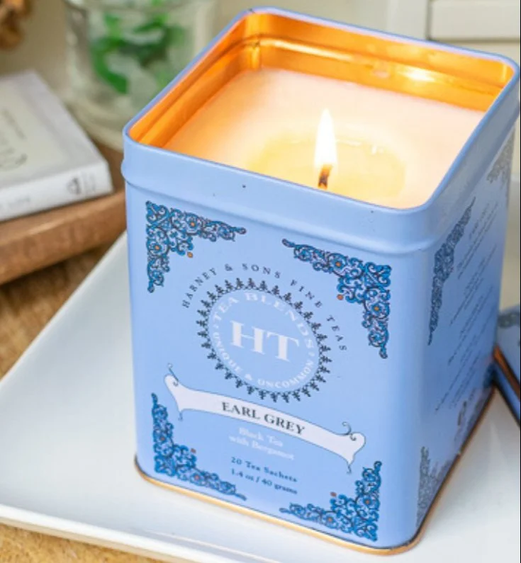 Hand poured candle in a decorative tea tin craft.