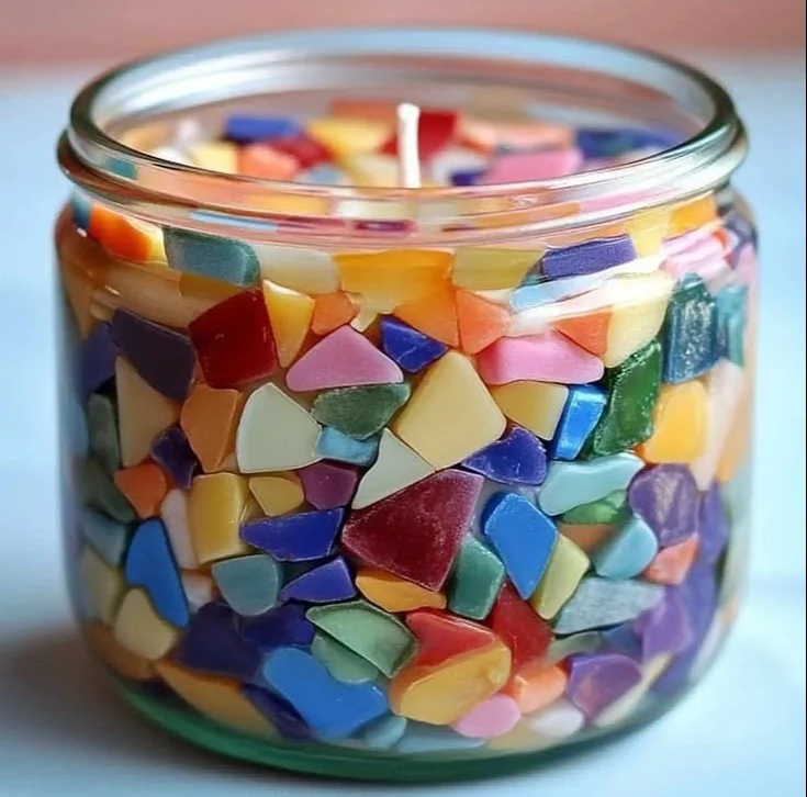 Handmade candles crafted with candle sand showcasing unique designs and vibrant colors.